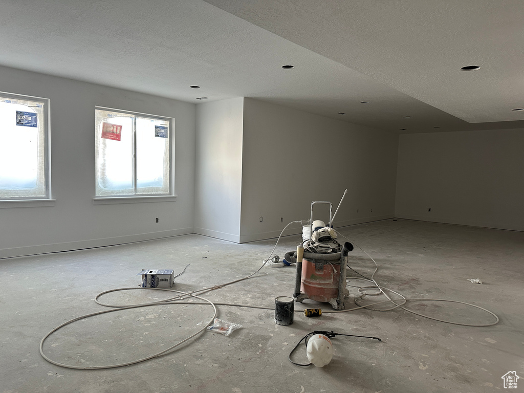 Unfurnished room with a textured ceiling