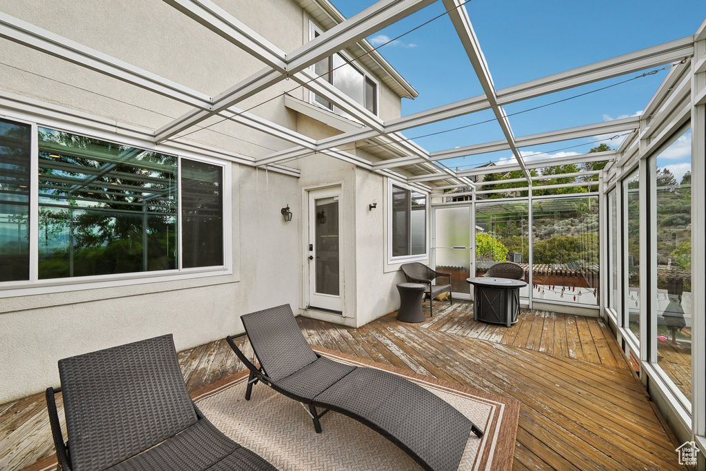 Sunroom featuring plenty of natural light and coffered ceiling