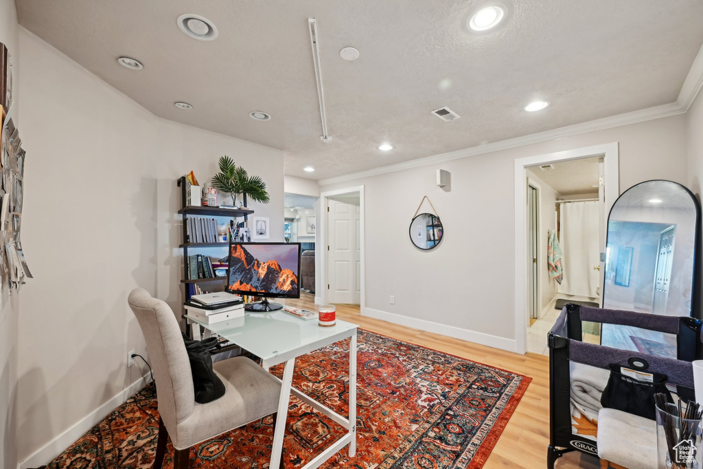 Office featuring baseboards, recessed lighting, light wood finished floors, and crown molding