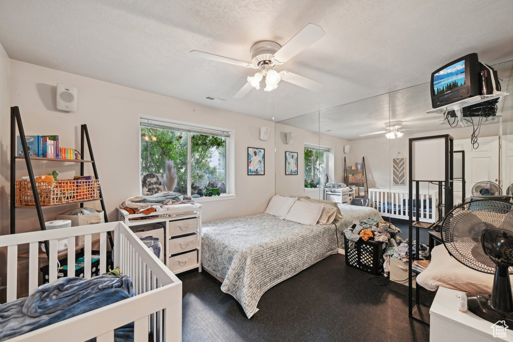 Bedroom featuring a textured ceiling