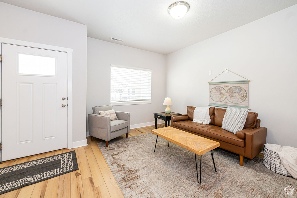 Living room with wood finished floors and baseboards