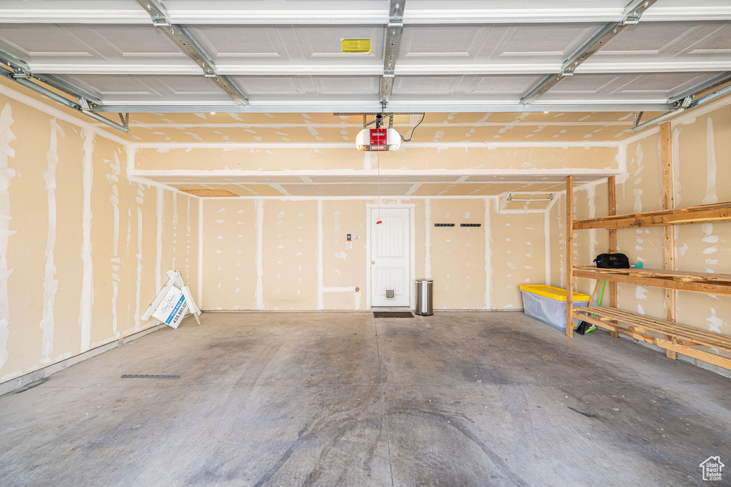 Garage featuring a garage door opener