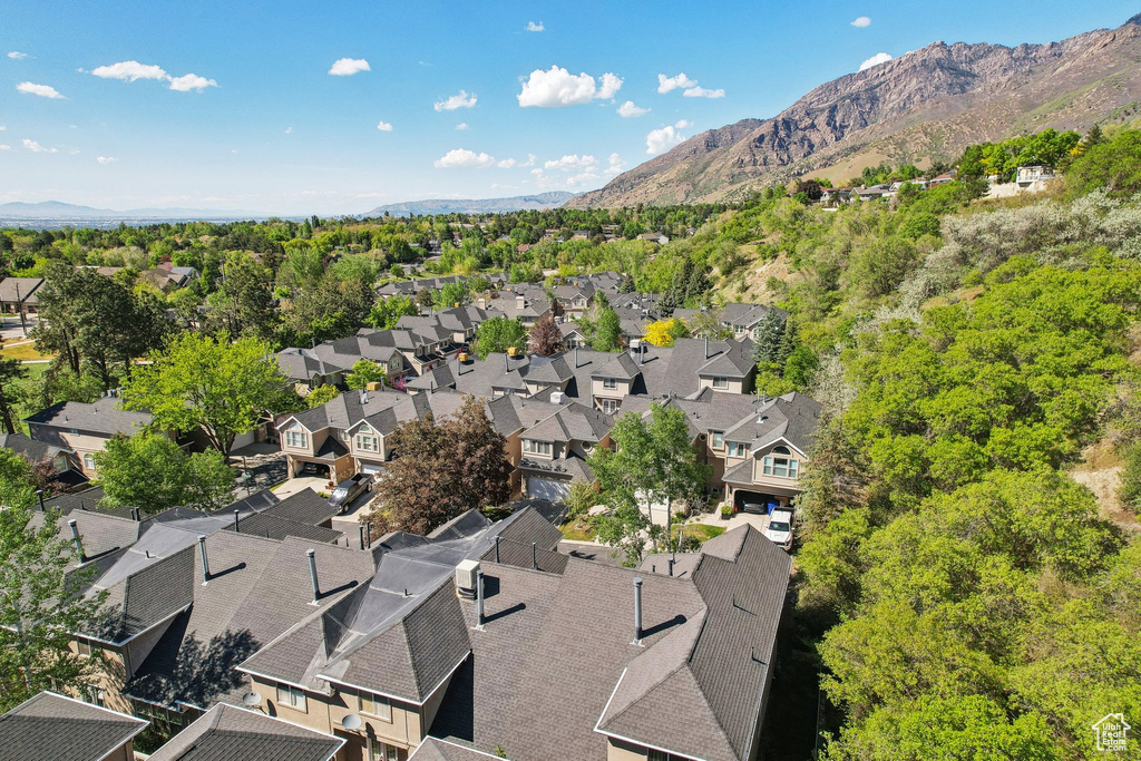Aerial perspective of suburban area with a mountain backdrop