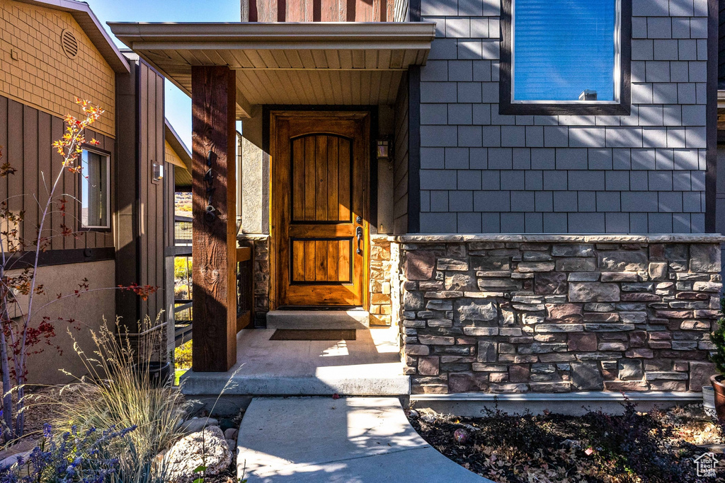 Property entrance with stone siding