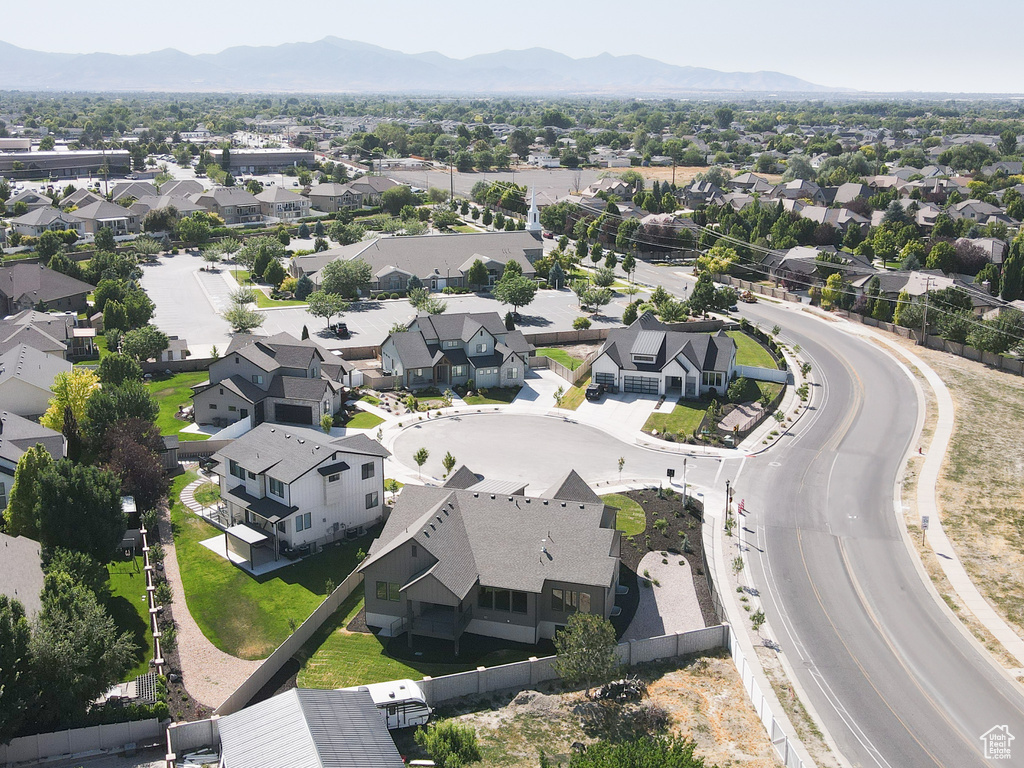 Aerial perspective of suburban area featuring a mountain backdrop