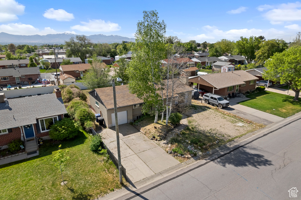 Aerial view of residential area featuring a mountain backdrop