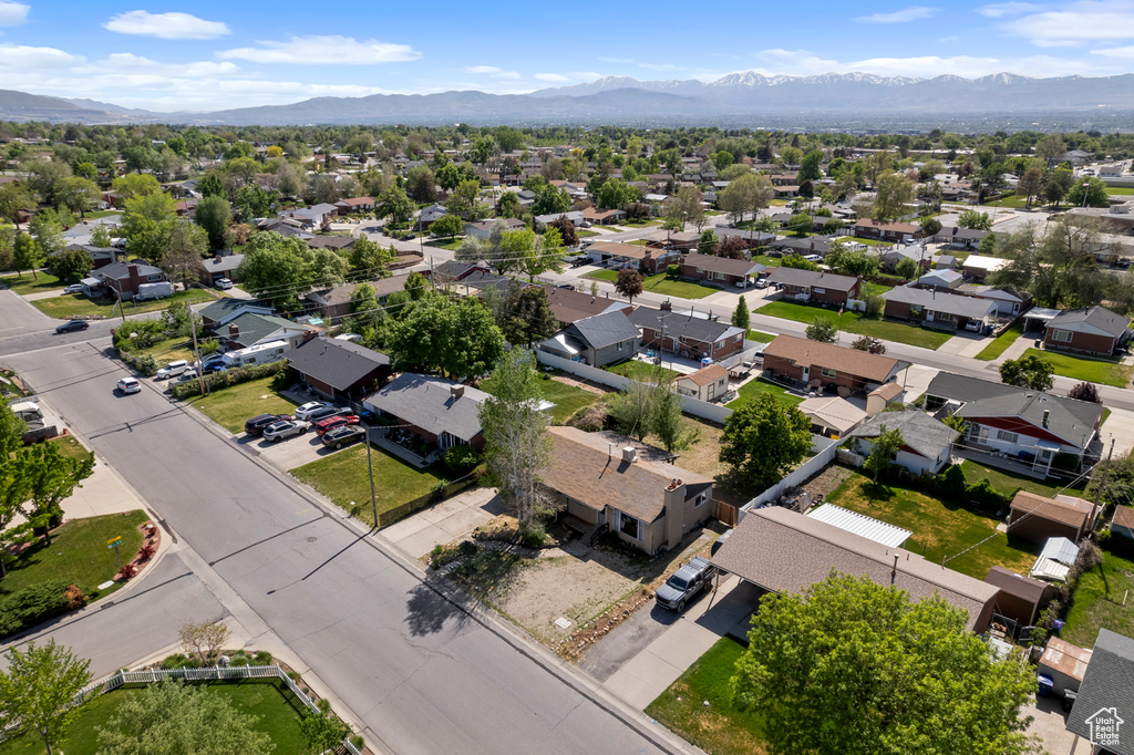Aerial view of residential area featuring a mountain backdrop