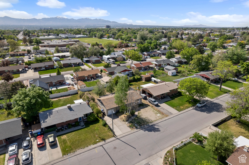 Aerial perspective of suburban area with a mountainous background