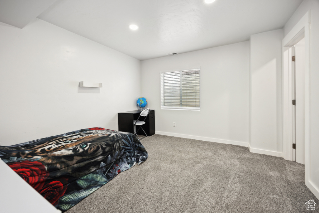 Bedroom featuring carpet, baseboards, and recessed lighting