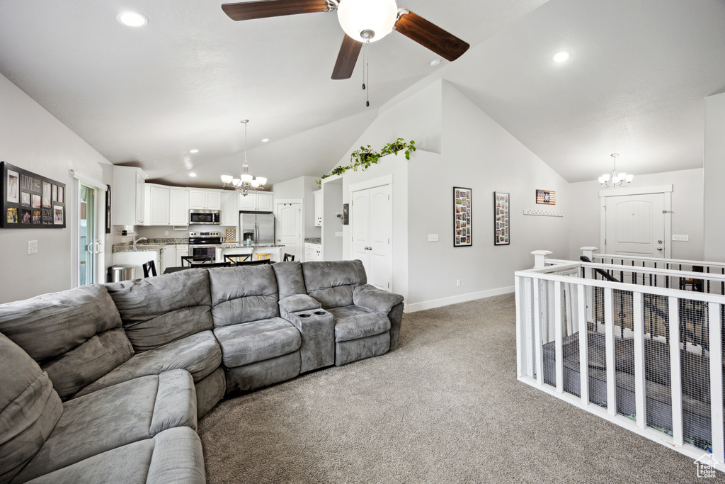 Living area with a chandelier, carpet flooring, baseboards, recessed lighting, and a ceiling fan