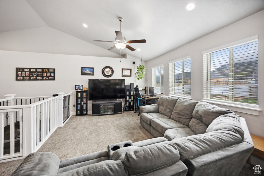 Living room featuring lofted ceiling, ceiling fan, carpet floors, and recessed lighting