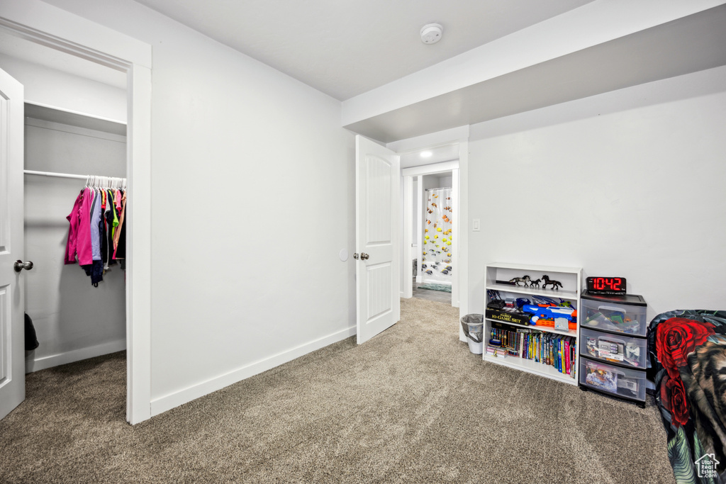 Playroom with carpet floors and baseboards