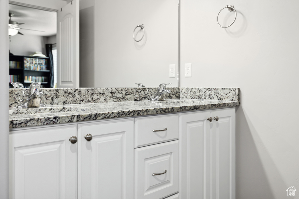 Bathroom featuring ceiling fan and vanity