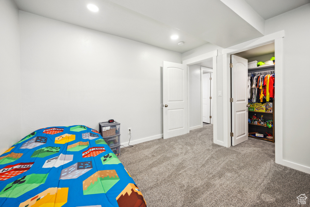Carpeted bedroom featuring baseboards and recessed lighting