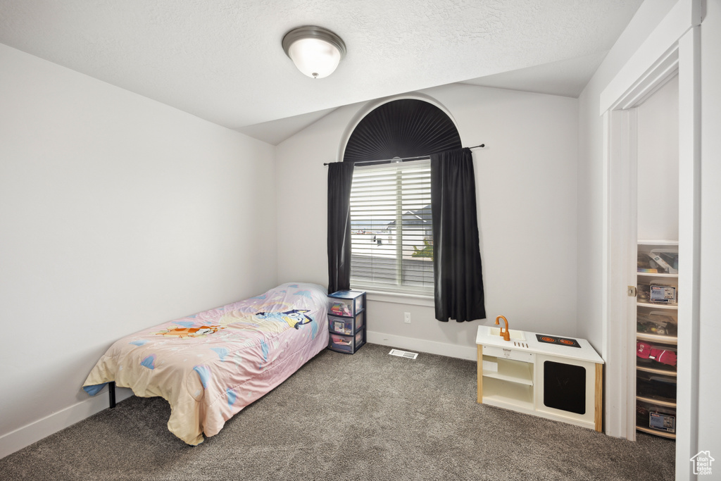 Bedroom with carpet floors and baseboards