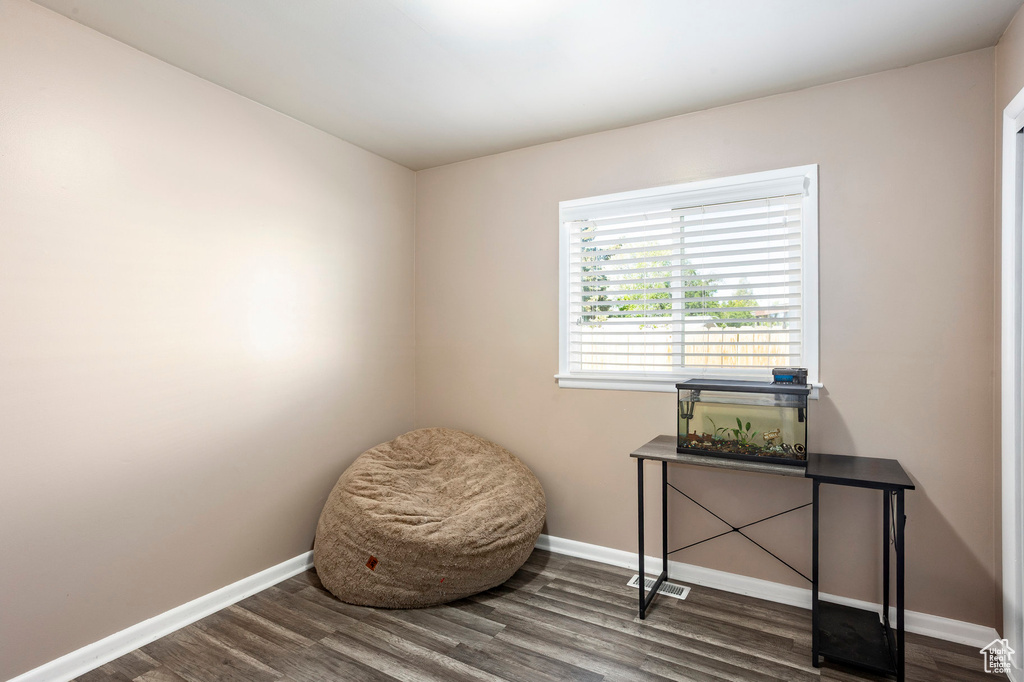 Living area featuring wood finished floors and baseboards