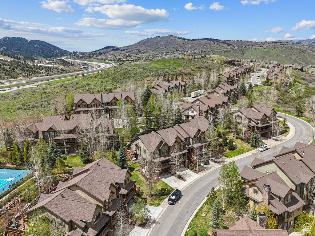 Aerial view of residential area featuring mountains