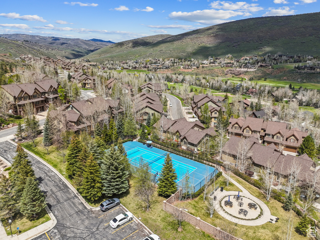 Aerial perspective of suburban area featuring a mountainous background