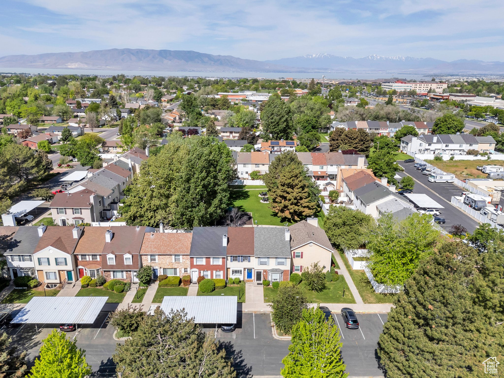 Aerial perspective of suburban area featuring a mountainous background