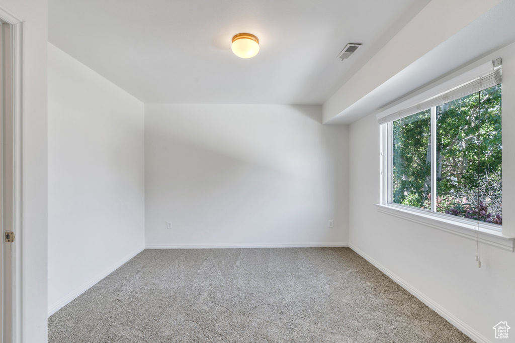 Unfurnished room featuring carpet flooring and baseboards