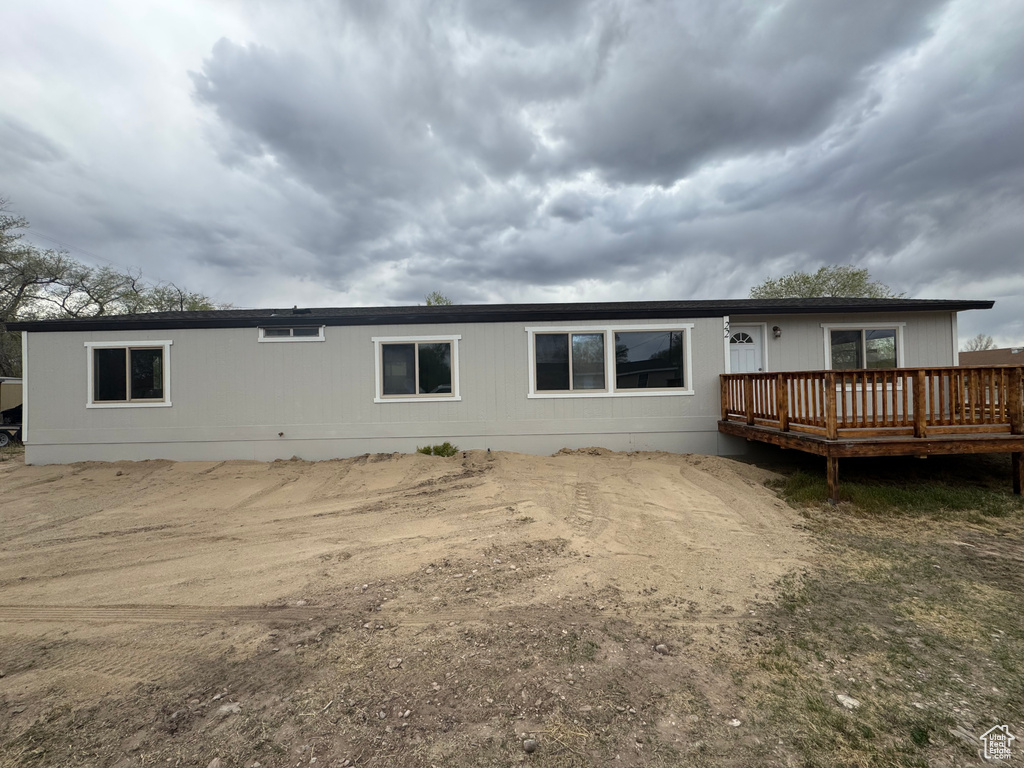 Back of house featuring a deck