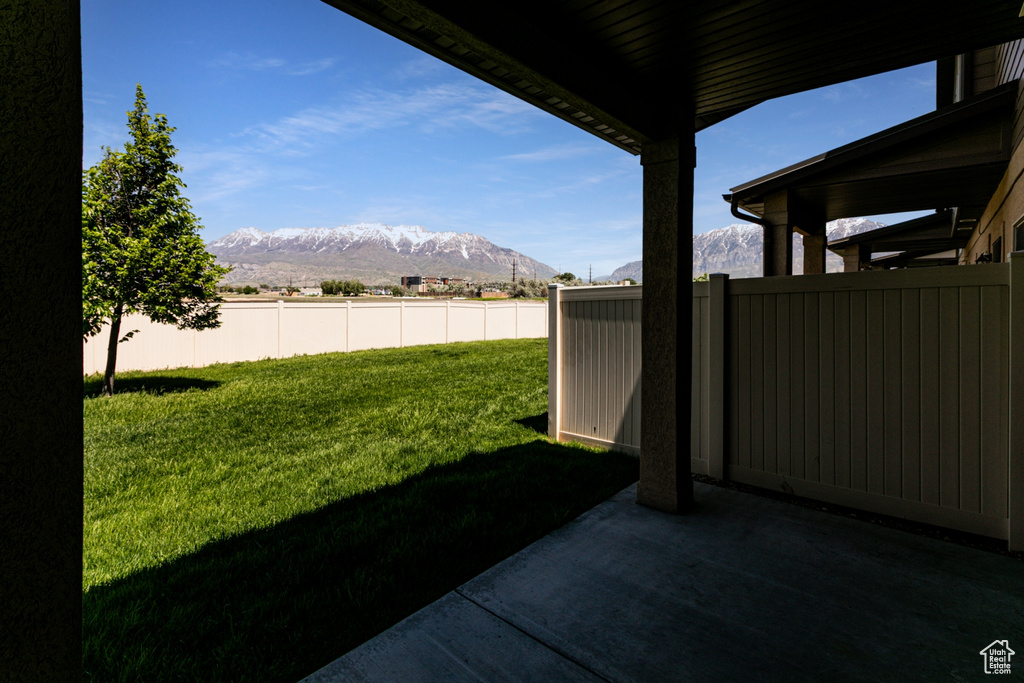 View of yard with a mountain view and a patio area