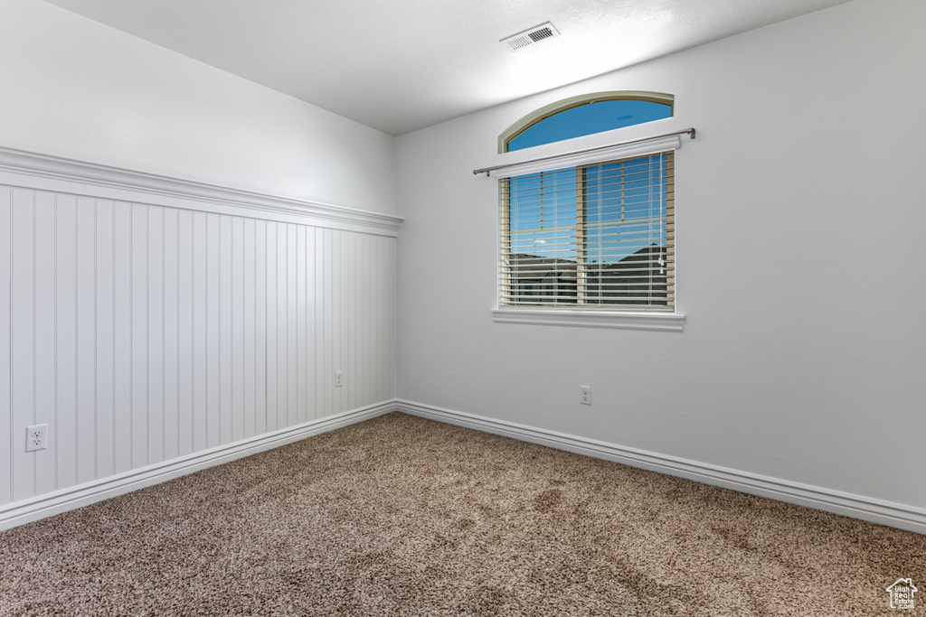 Spare room with carpet flooring and baseboards