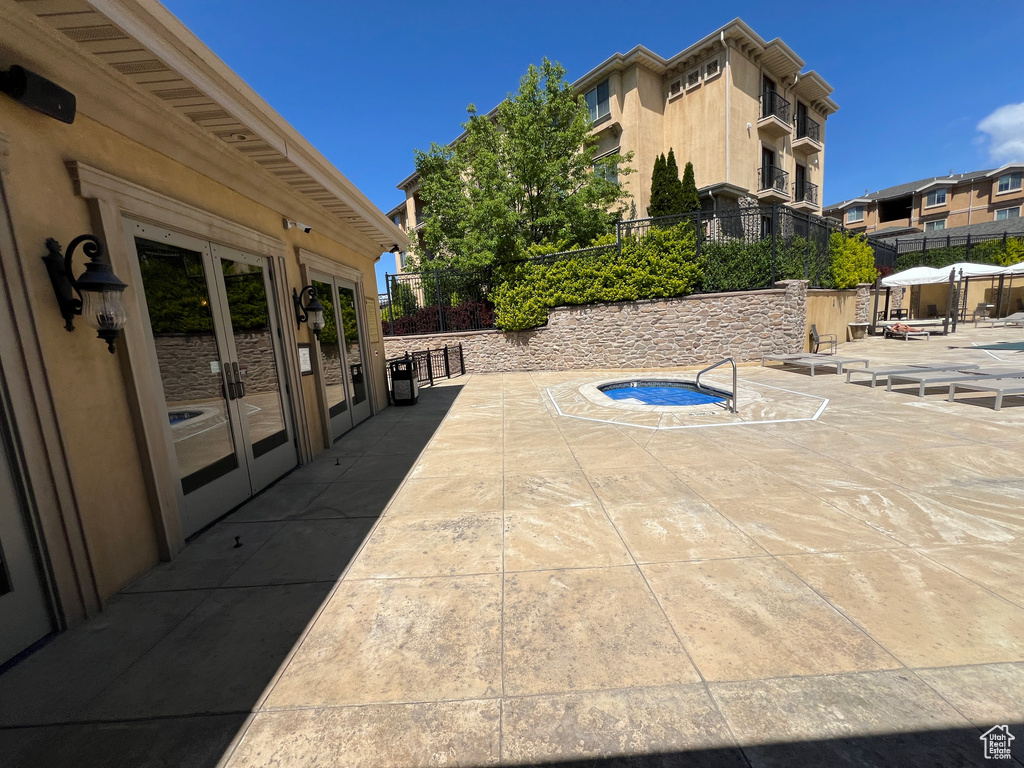 View of patio / terrace featuring french doors and fence