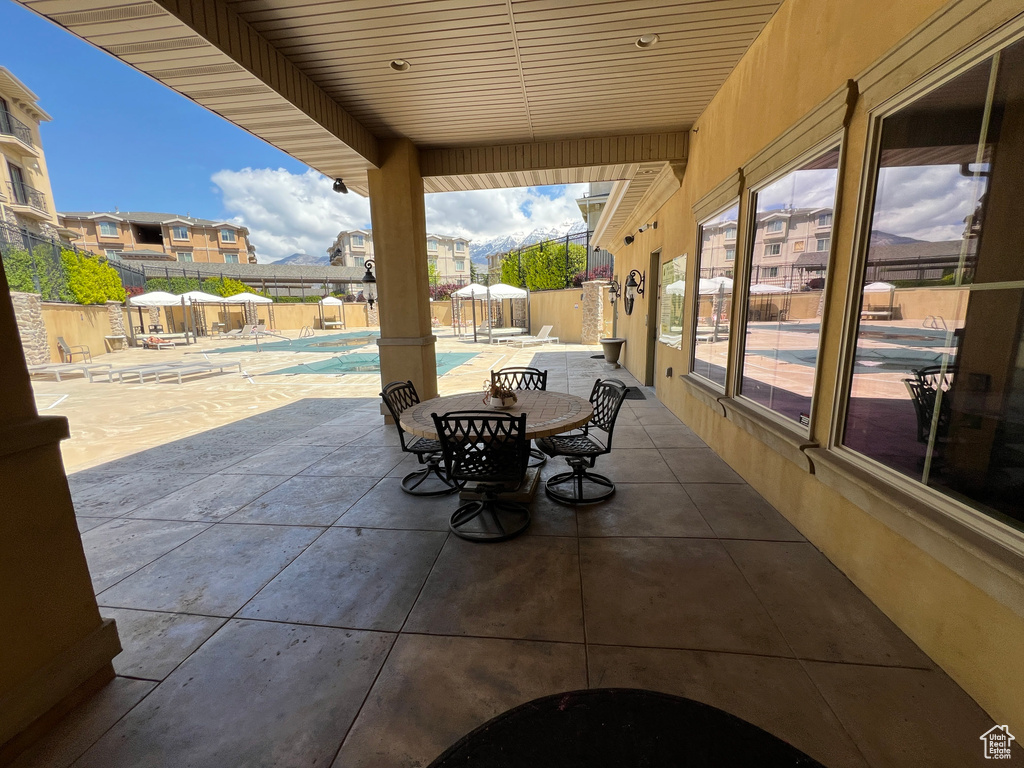 View of patio / terrace with a fenced backyard and a community pool