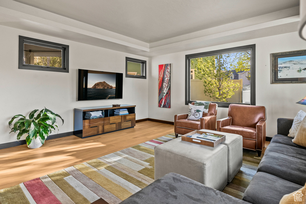 Living area featuring wood finished floors and baseboards