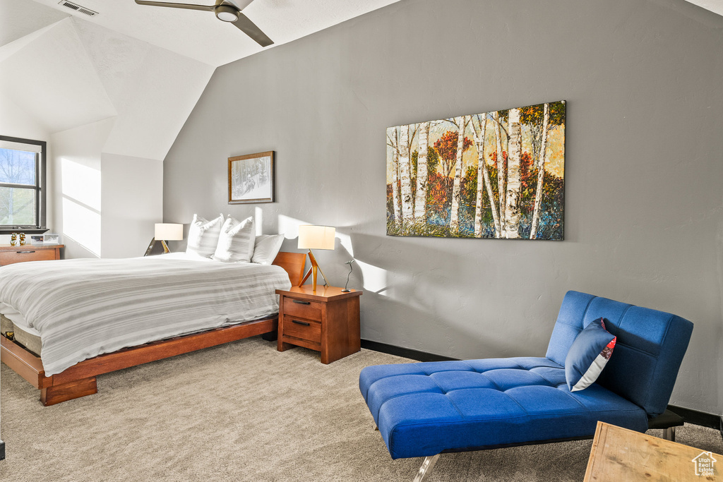 Bedroom with carpet flooring, vaulted ceiling, baseboards, and a ceiling fan