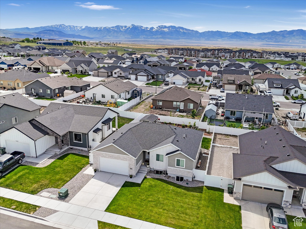 Aerial perspective of suburban area featuring a mountain backdrop