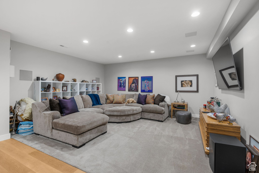 Living room with recessed lighting and baseboards