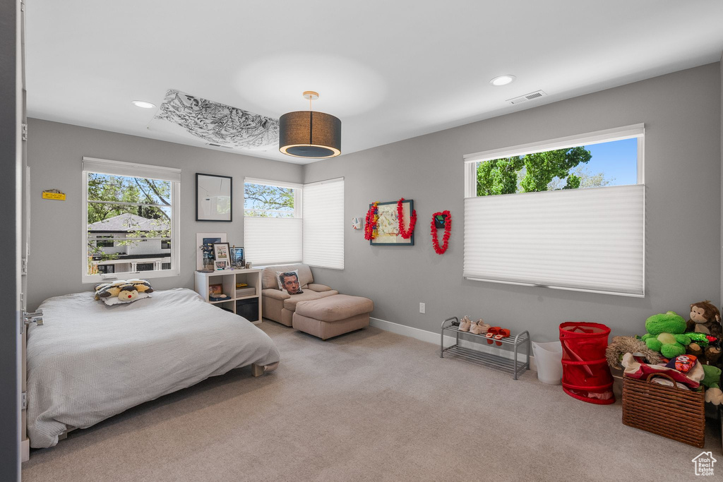Carpeted bedroom featuring recessed lighting and baseboards