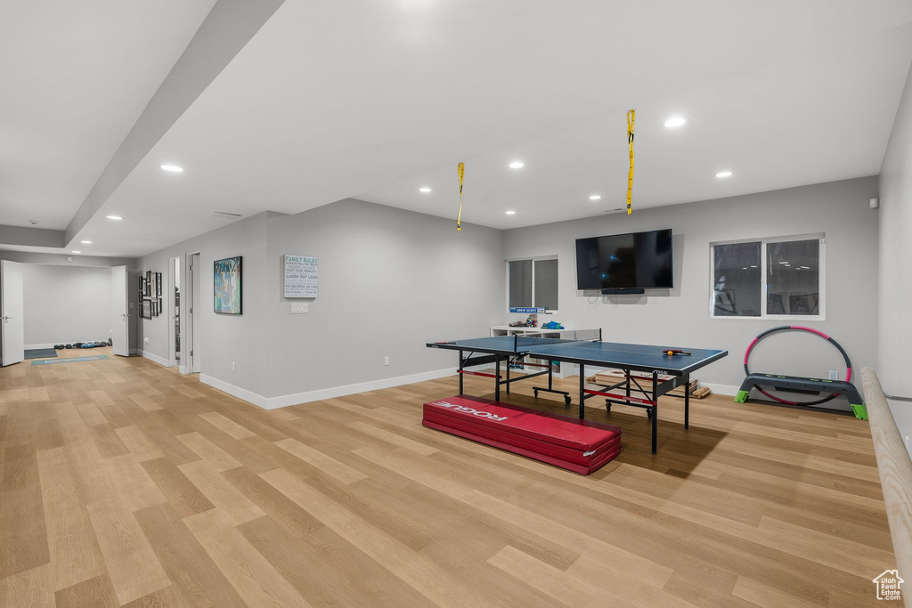 Rec room featuring baseboards, recessed lighting, and light wood-style floors