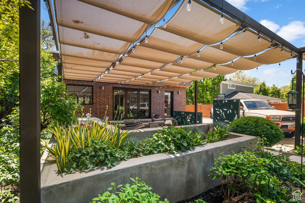 View of patio / terrace with a pergola and an outdoor living space