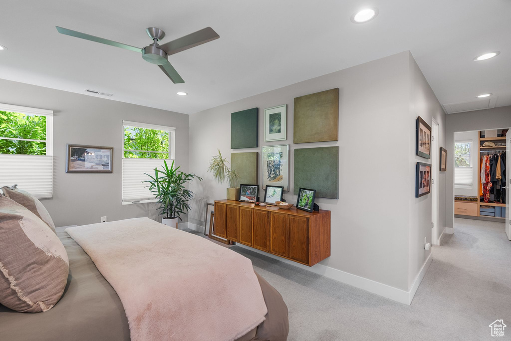 Bedroom featuring baseboards, recessed lighting, ceiling fan, and light colored carpet
