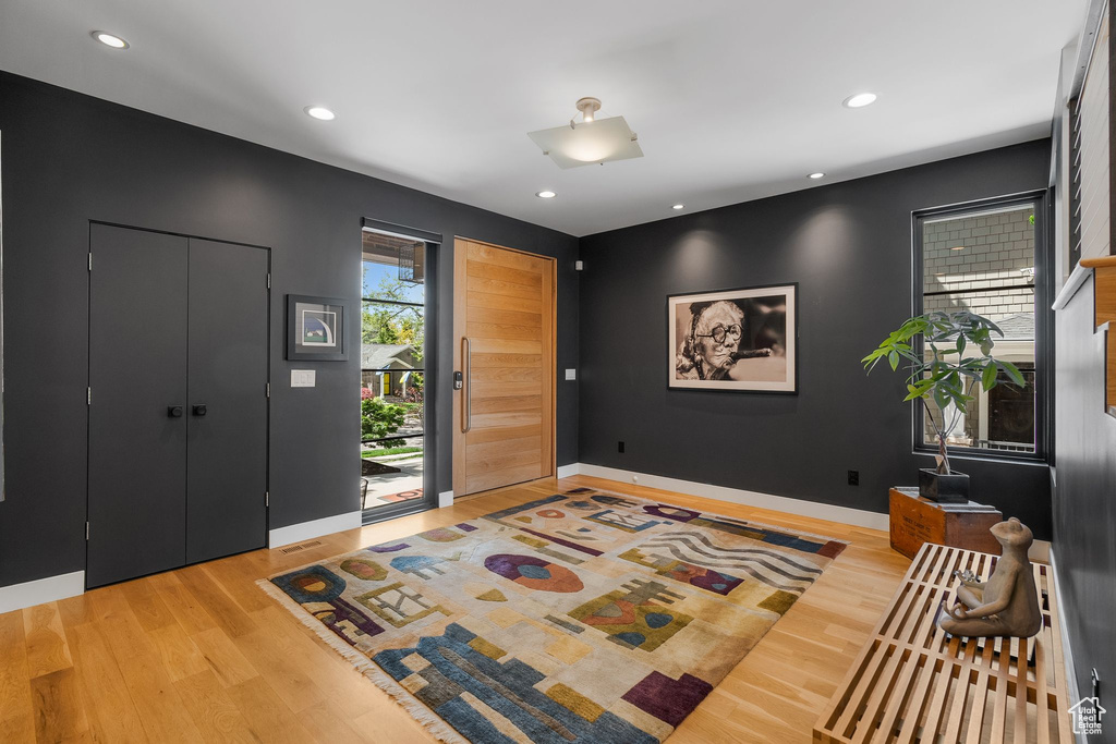 Foyer entrance featuring light wood-style flooring, baseboards, and recessed lighting