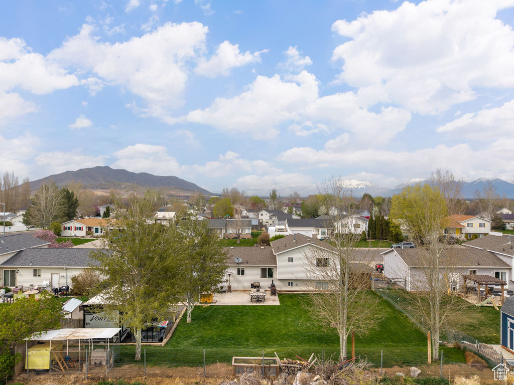 View of mountain backdrop featuring nearby suburban area