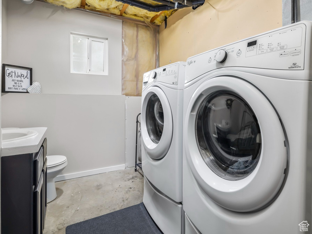 Laundry room featuring washing machine and dryer
