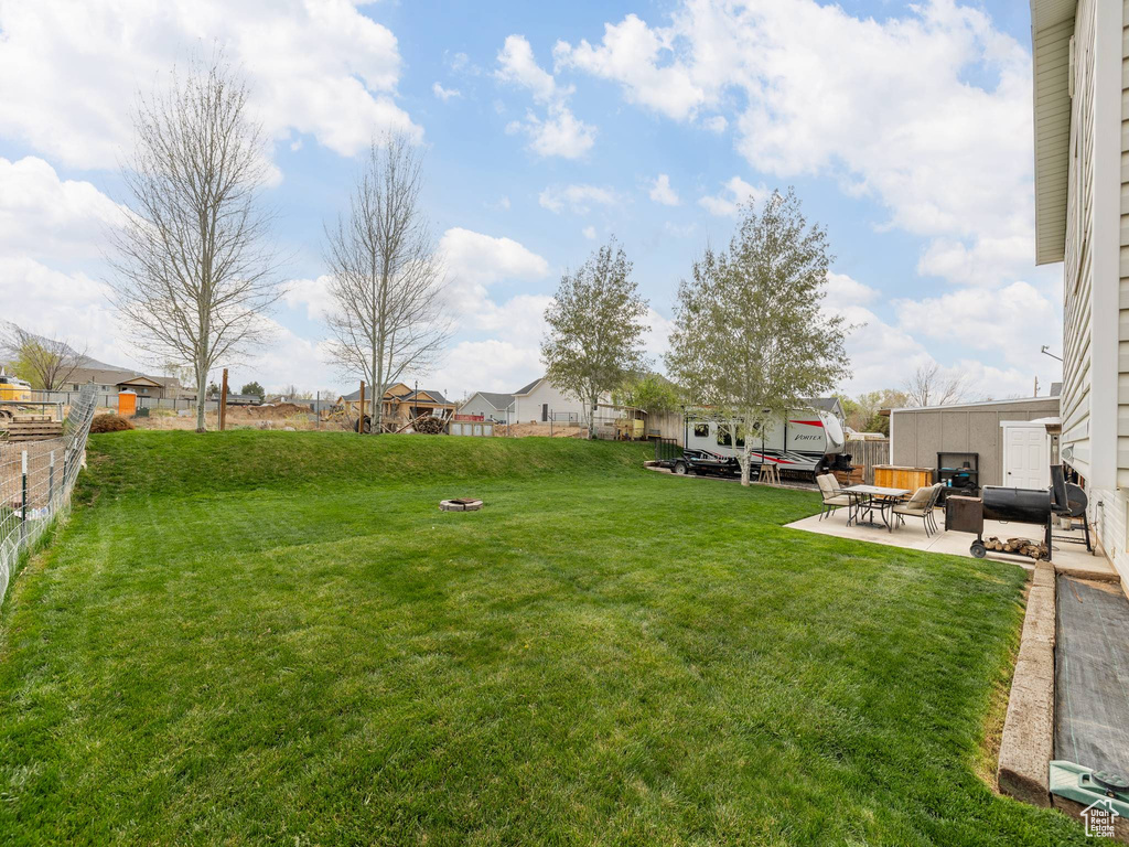 View of yard with a patio area