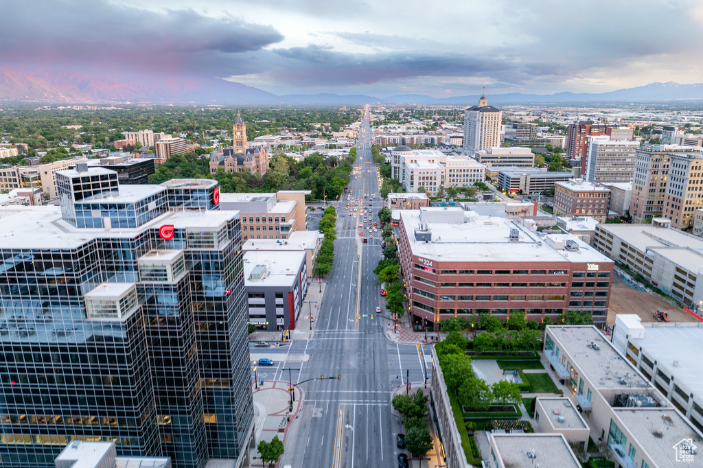 Aerial view at dusk of a view of city and a mountain view