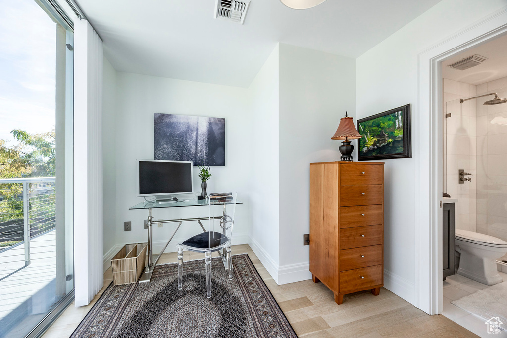 Home office featuring light wood-style floors