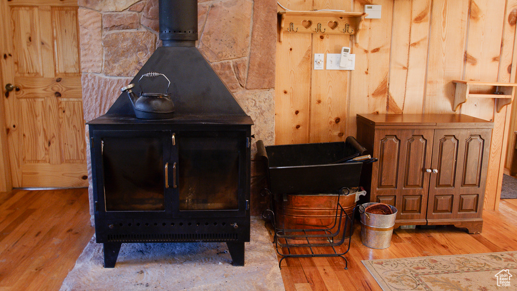 Detailed view of a wood stove and wood finished floors