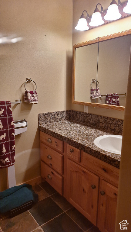 Bathroom featuring vanity and tile patterned floors