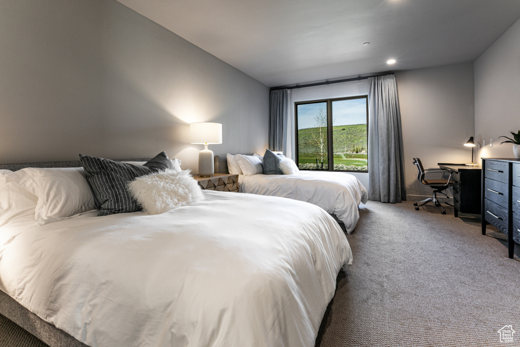 Carpeted bedroom featuring recessed lighting