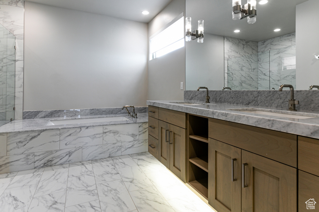 Full bath featuring a marble finish shower, marble finish flooring, recessed lighting, a garden tub, and double vanity