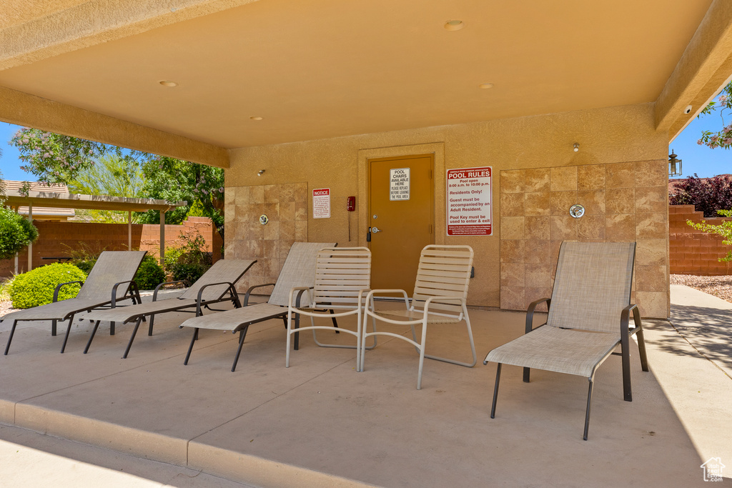View of patio with fence