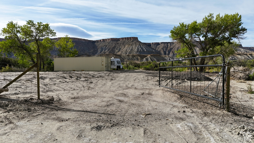 View of yard featuring a gate and a mountain view