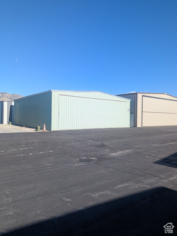 View of outbuilding with an outdoor structure